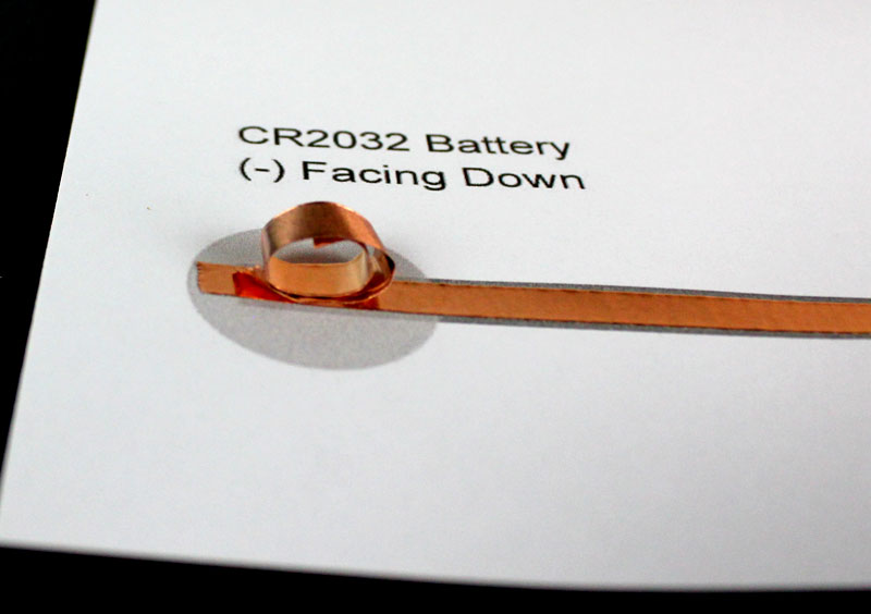 attach coin cell battery to template